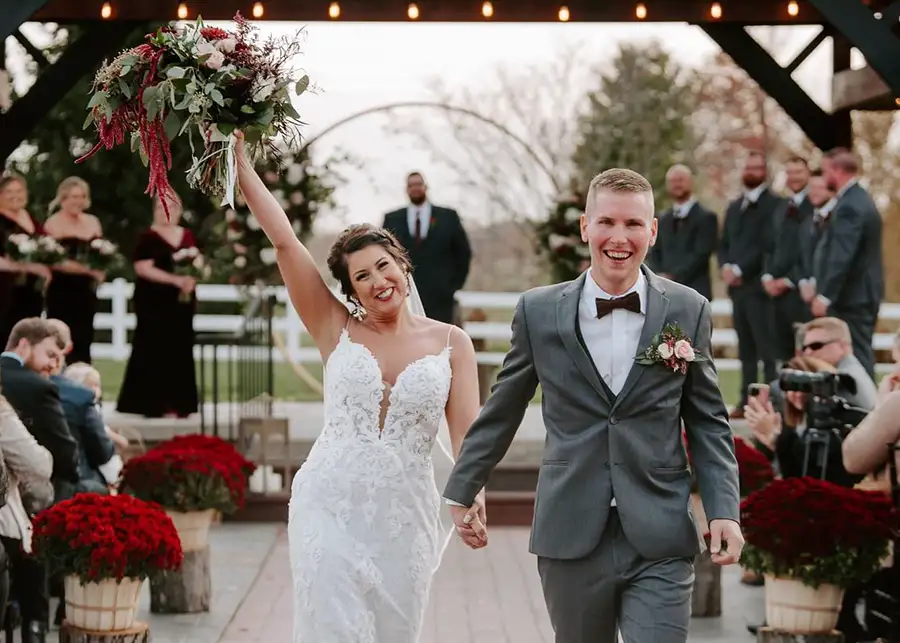 Paul's Paradise - happy couple walks back up the aisle of outdoor wedding venue, celebrating their nuptials - Pleasant Plains, IL
