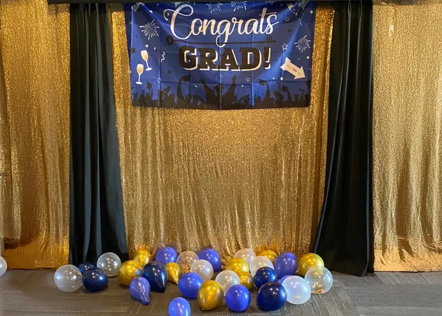 Paul's Paradise - photo booth set up with golden backdrop, graduation party held in the reception hall - Pleasant Plains, IL
