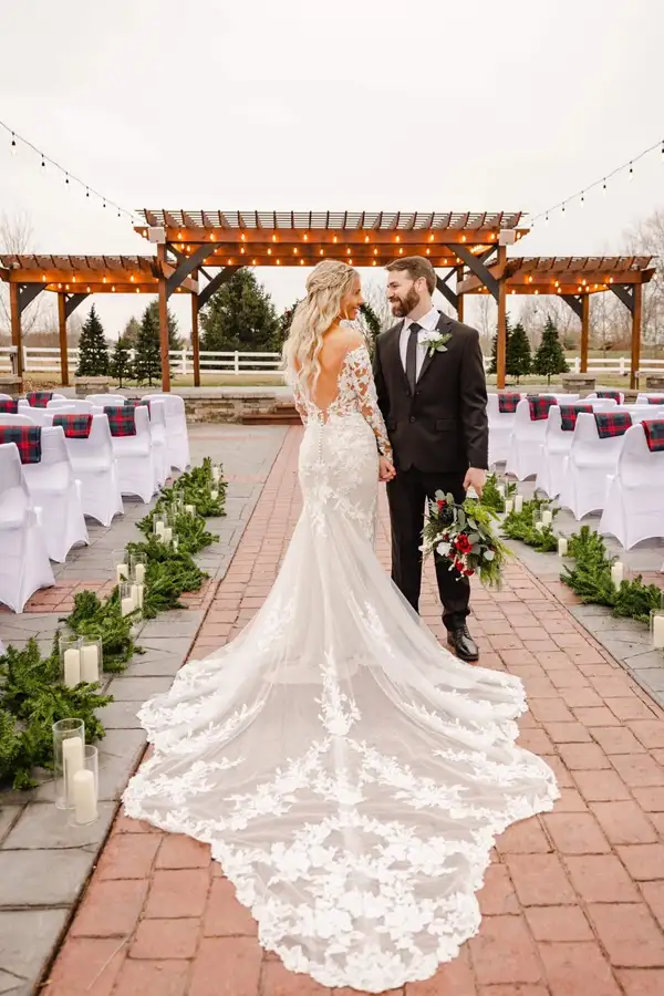 Paul's Paradise - outdoor wedding venue, couple posing in winter styled aisle before ceremony - Pleasant Plains, IL