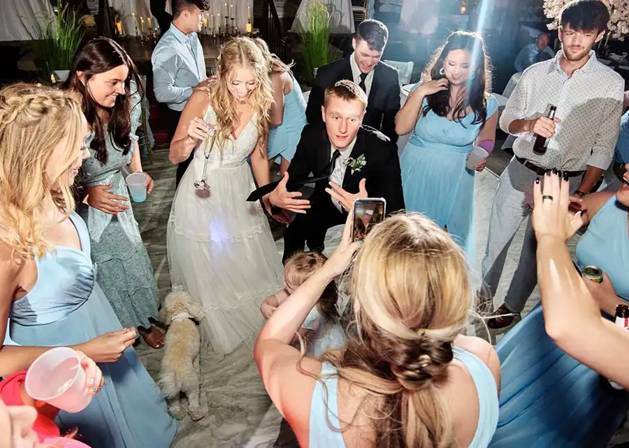 Paul's Paradise - bride and groom dancing on the dance floor with their wedding party and guests - Pleasant Plains, IL